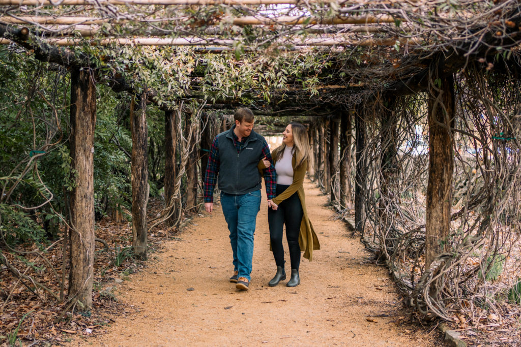 Couple walking in the arboretum