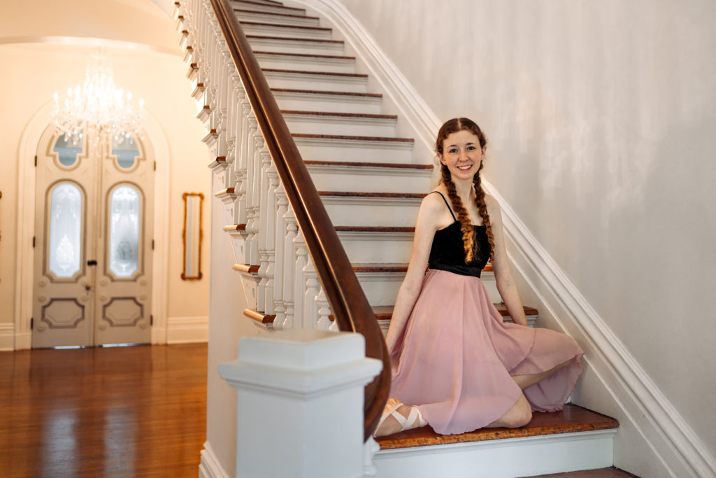 ballerina sitting on staircase