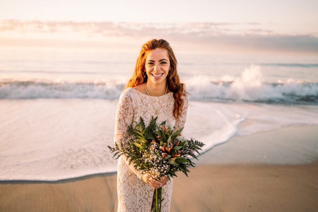 bride laughing with bouquet on Topsail Island