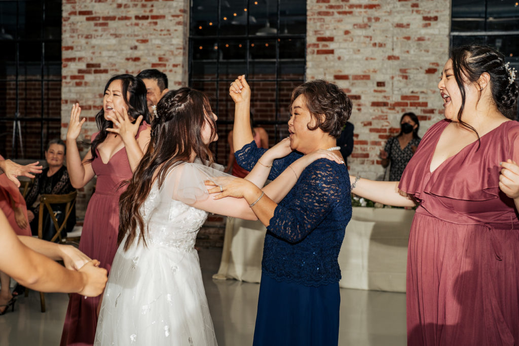 bride dancing with mom on the dance floor