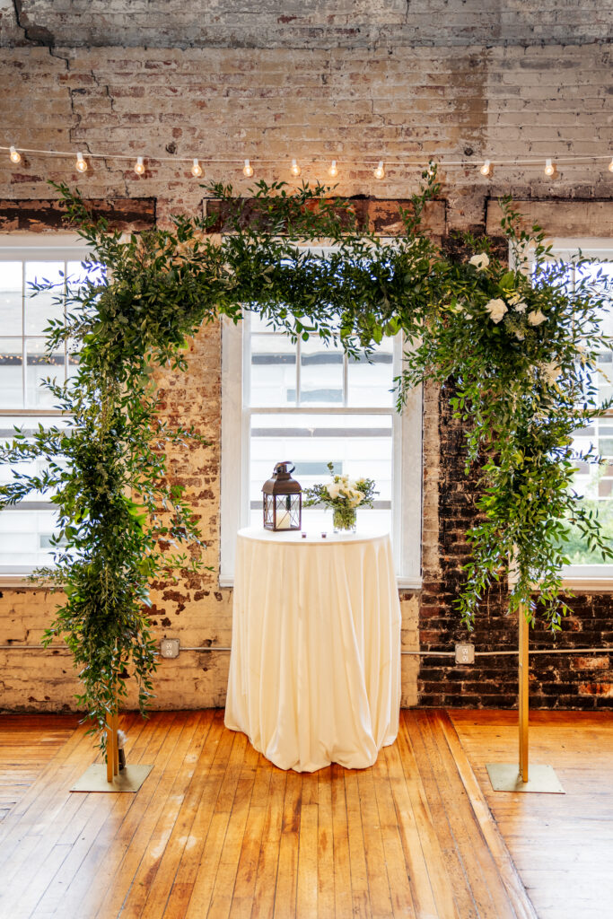 wedding ceremony arch at the Stockroom at 230 wedding in downtown Raleigh, NC