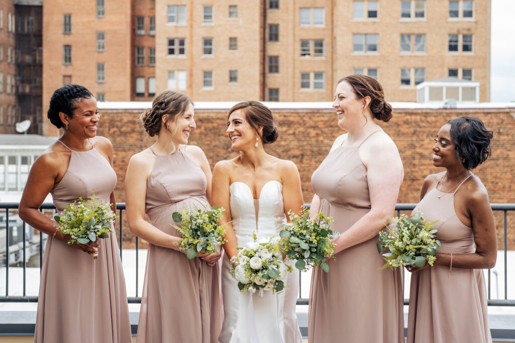bride and bridesmaids portraits at the Glass Box in Downtown Raleigh, NC