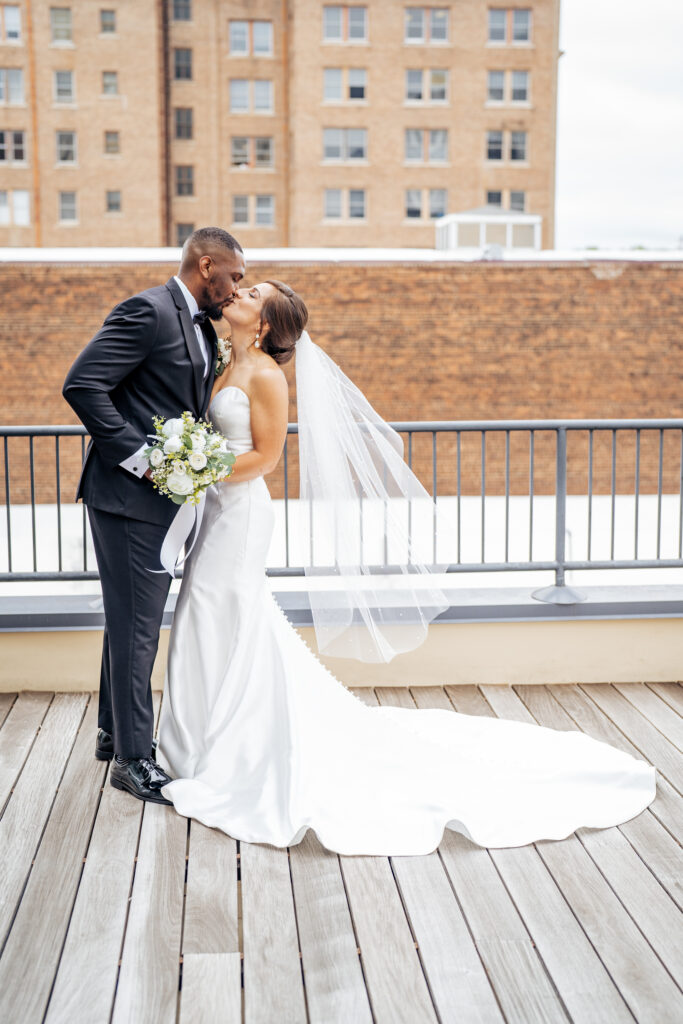 bride and groom kiss at the Stockroom at 230 wedding in downtown Raleigh, NC