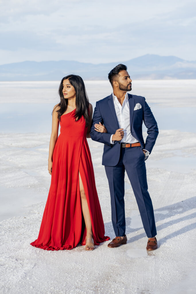 Bonneville Salt Flats engagement photos in red dress and navy suit