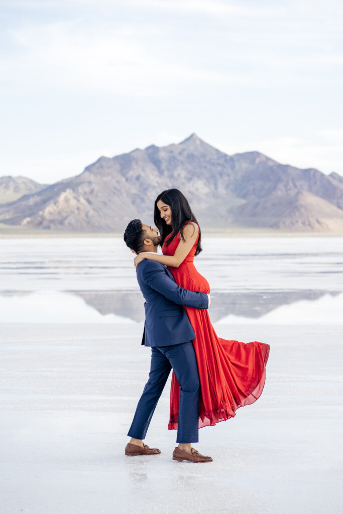 Man spins fiancé during engagement photos at the Bonneville Salt Flats