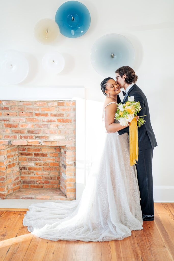 wedding portrait in front of the fireplace at the Upchurch