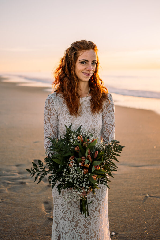 Bride on Topsail Island, NC beach at sunrise