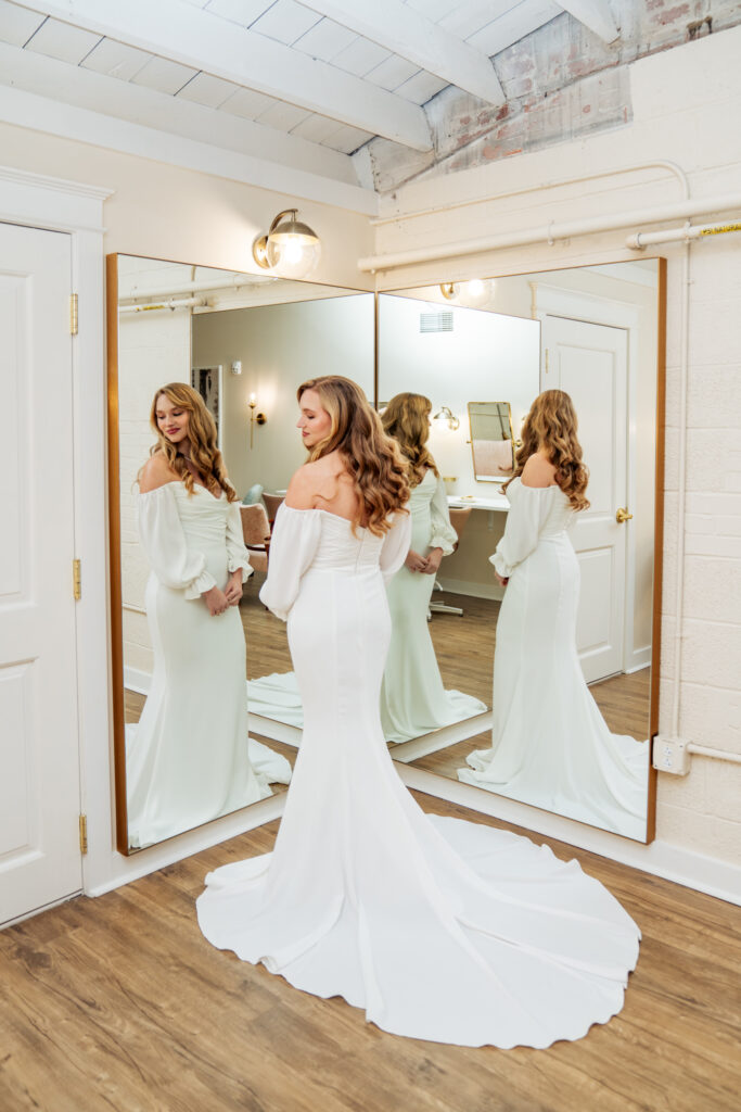 bride standing in front of mirror in bridal gown at the Lincoln on Geer