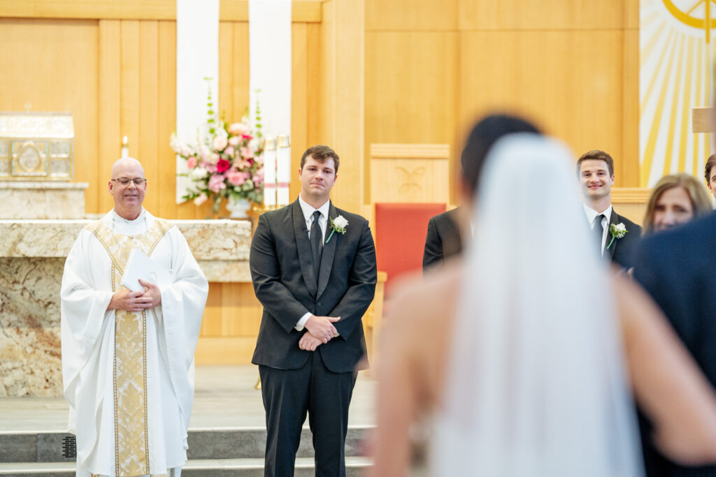 Groom sees bride for first time walking down the aisle