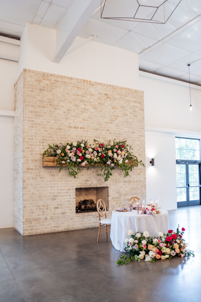 The Maxwell wedding venue fireplace decorated with florals