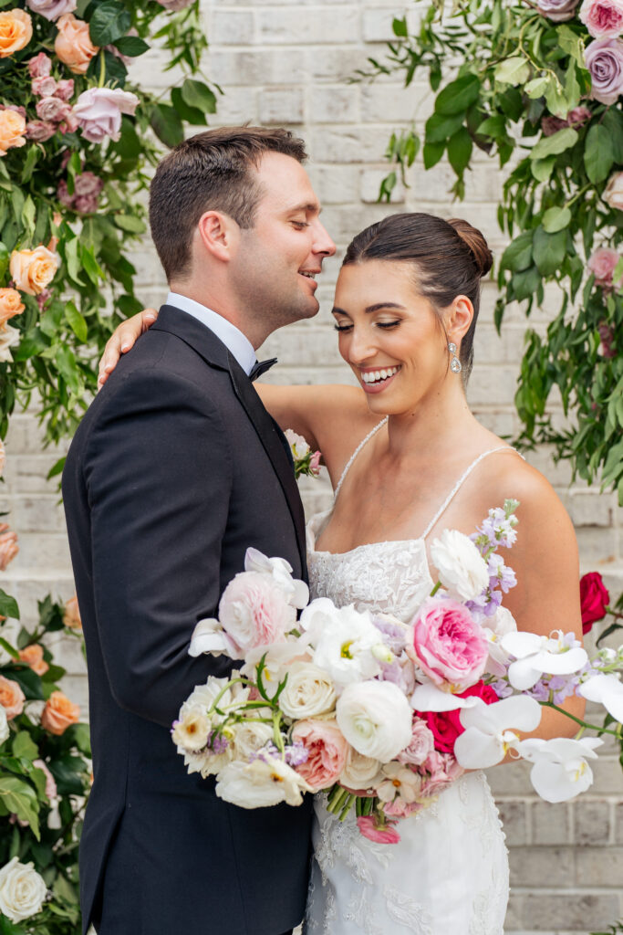 bride and groom laughing at wedding ceremony in Raleigh