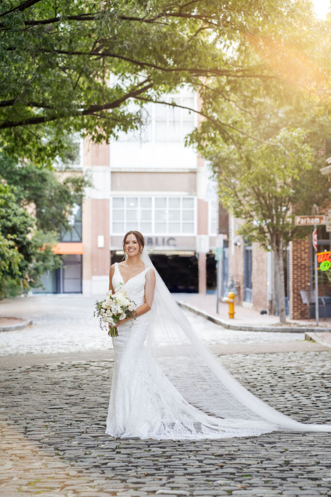 bridal portrait on the cobblestone at Market Hall in downtown Raleigh