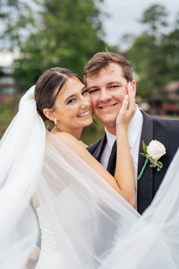 bride and groom smiling for portrait