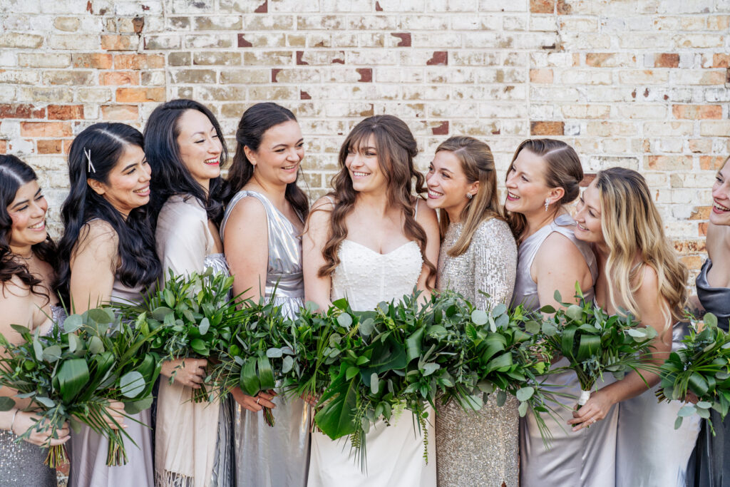 bride laughing with bridesmaids