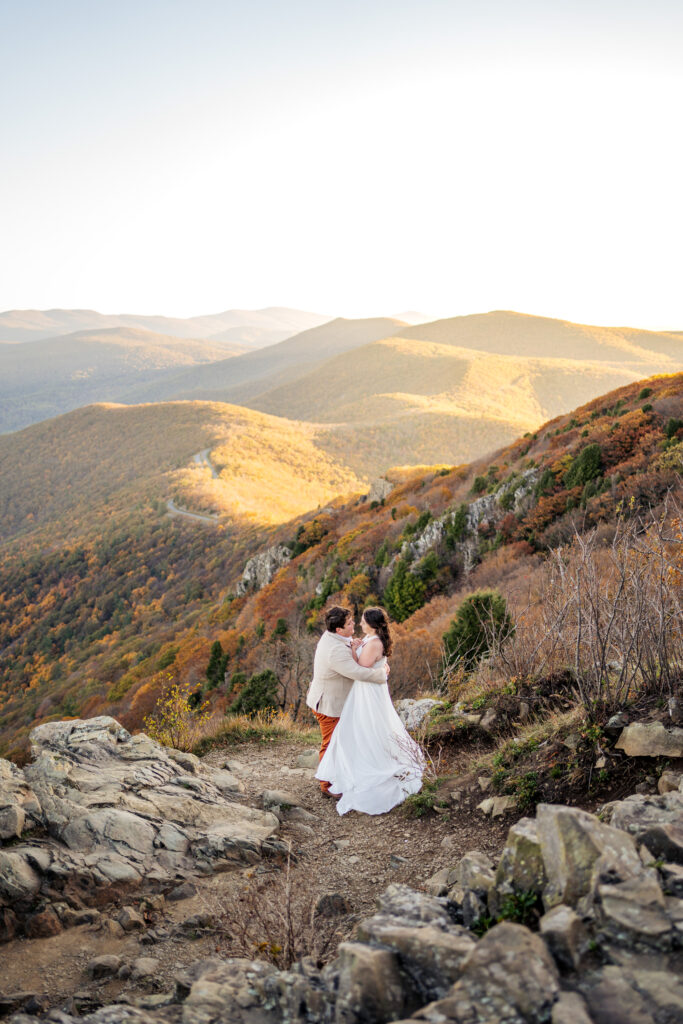 bride and groom embrace at Stony Man Mountain in Shenandoah National Park