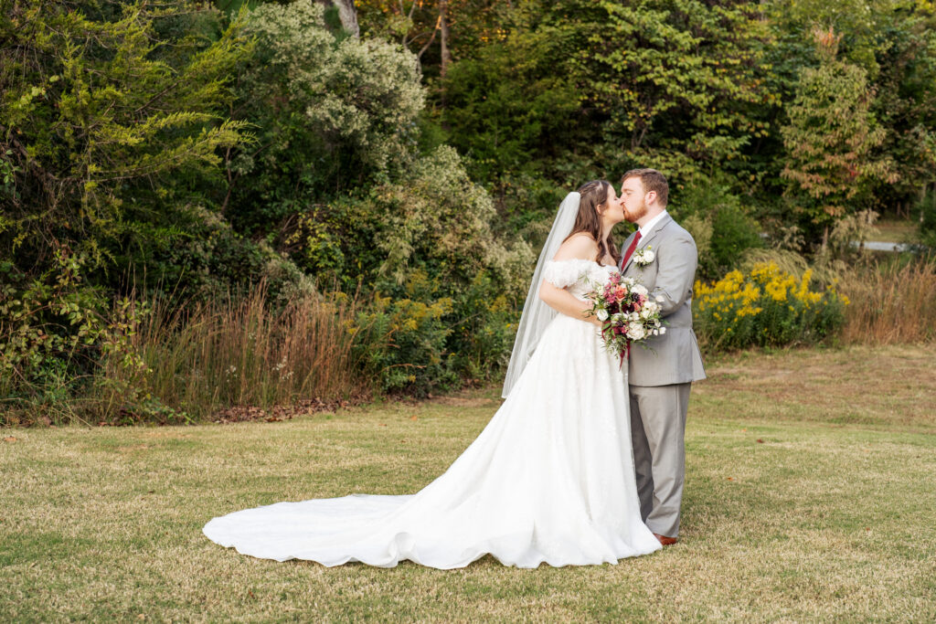 bride and groom kiss at the Barn of Chapel Hill wedding