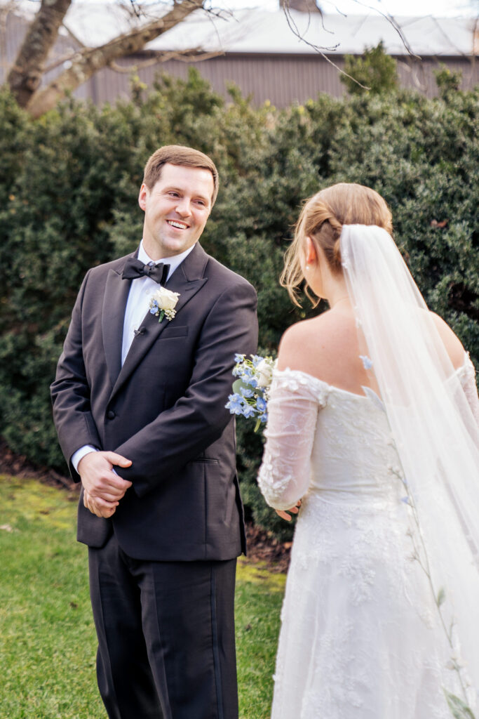 groom sees bride for first time at wedding