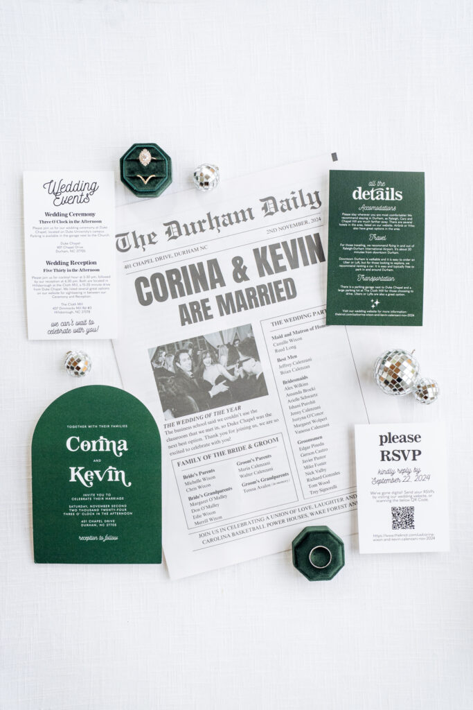 wedding flat lay with emerald green invitation suite