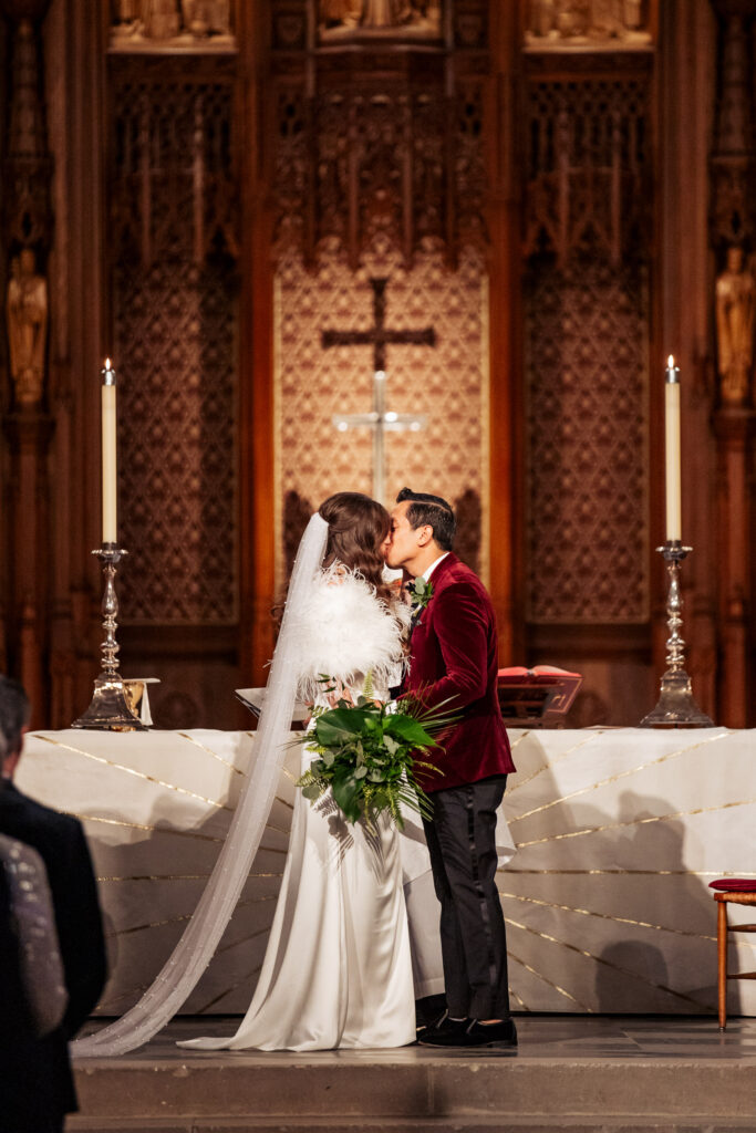 bride and groom kiss at Duke Chapel wedding