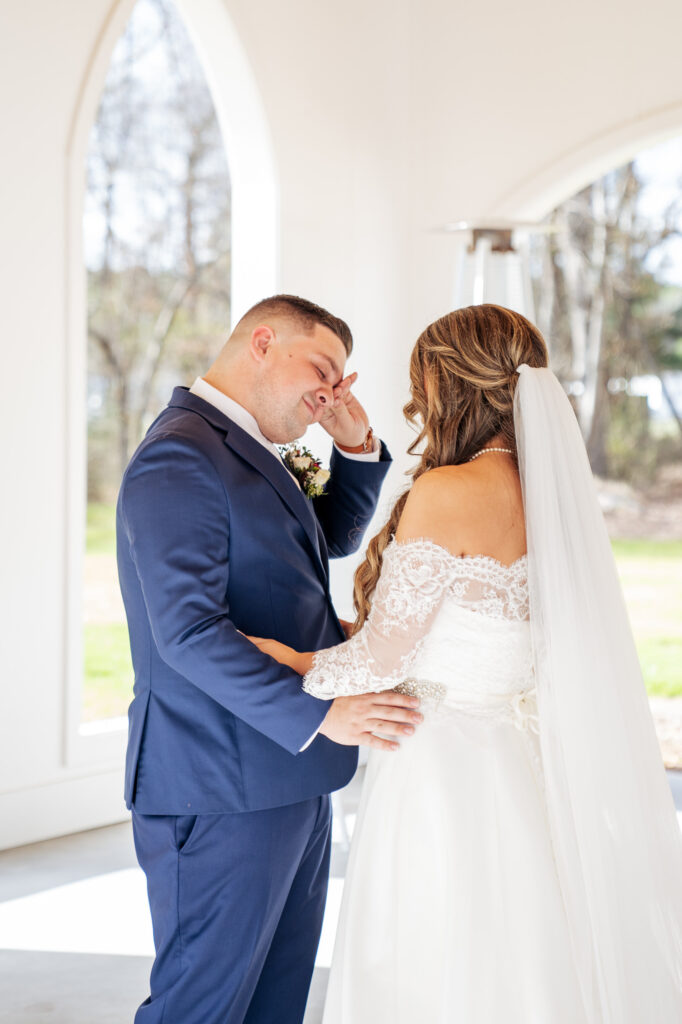 groom crying during first look