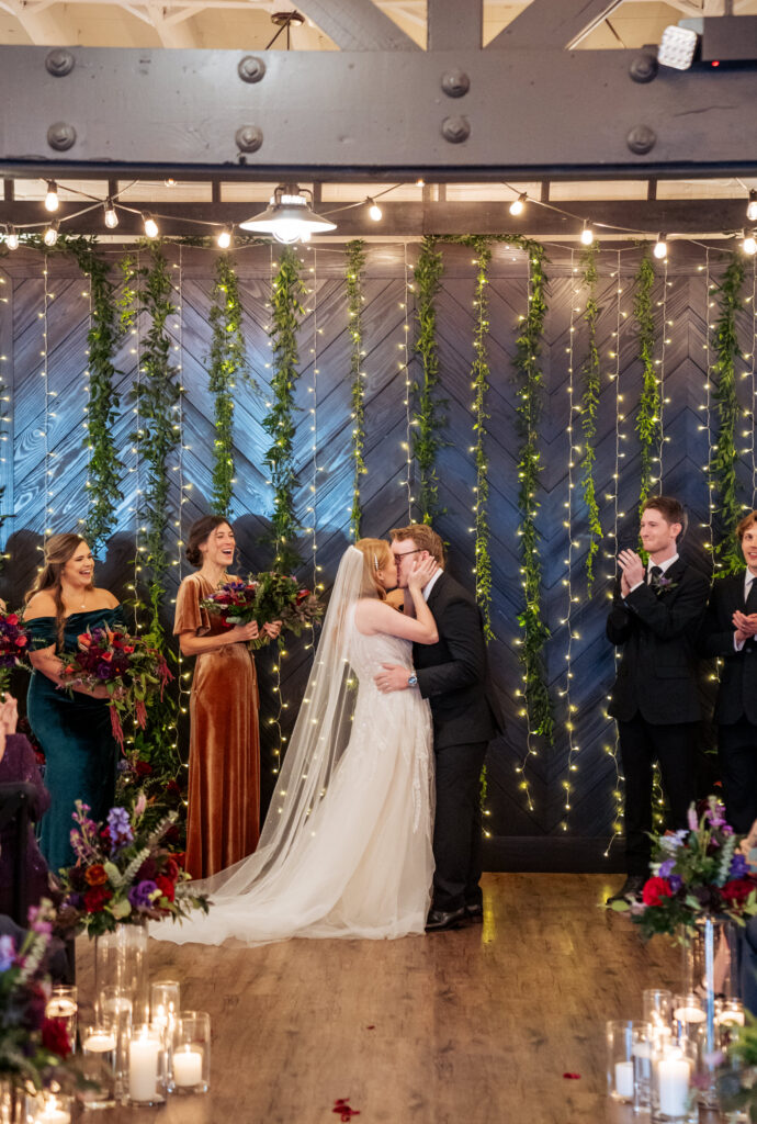 bride and groom first married kiss