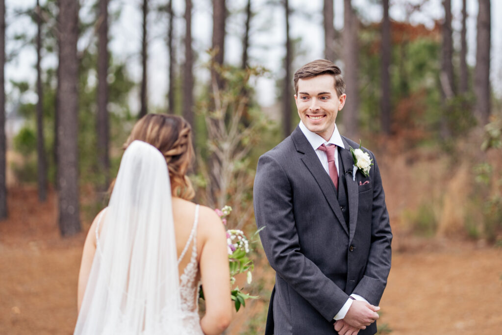 groom sees bride for first time in first look