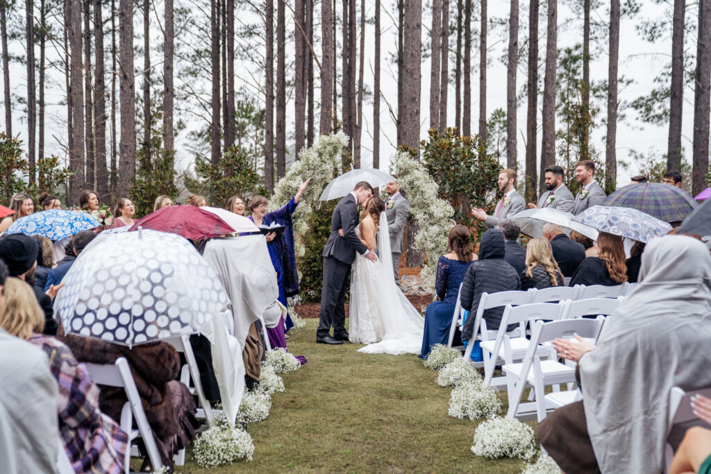rainy outdoor wedding ceremony at the Upchurch in Cary, NC