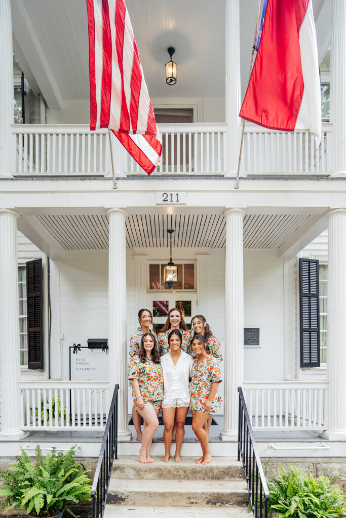 bride smiling with bridesmaids at Haywood Hall